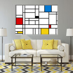 Tableau Mondrian Géométrique. Bonne qualité, original, accrochée sur un mur au dessus d'un canapé dans un salon