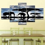 Tableau africain éléphants à l'ombre d'un arbre. Bonne qualité, original, accrochée sur un mur au dessus d'une table à manger dans un salon
