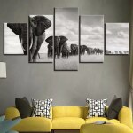Tableau africain éléphants en file dans la savane. Bonne qualité, original, accrochée sur un mur au dessus d'un canapé dans un salon