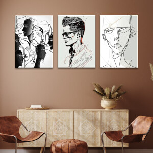 Tableau visage contemporain minimaliste accroché sur le mur marron d'un salon avec fauteuils en cuir et meuble en bois