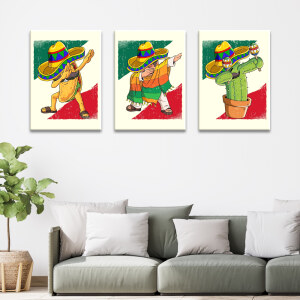 Tableau Mexique symboles humoristiques dab accroché dans un salon au-dessus d'un canapé bas dans les tons gris avec des coussins clairs et une plante en pot à côté.